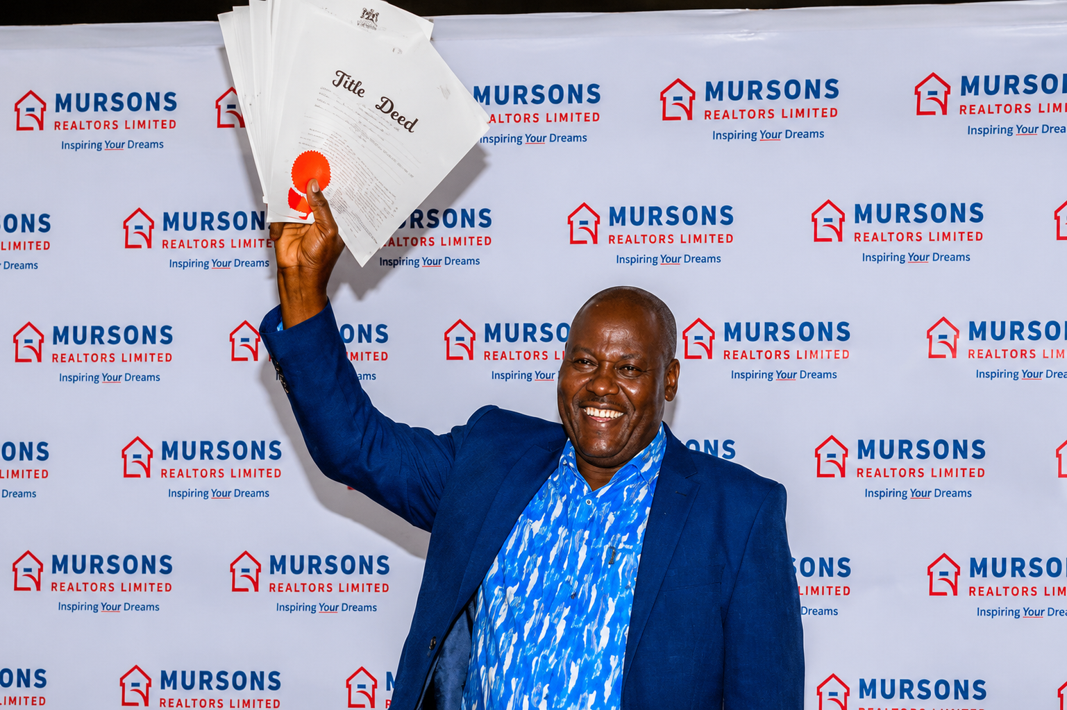 Mursons client receiving title deed